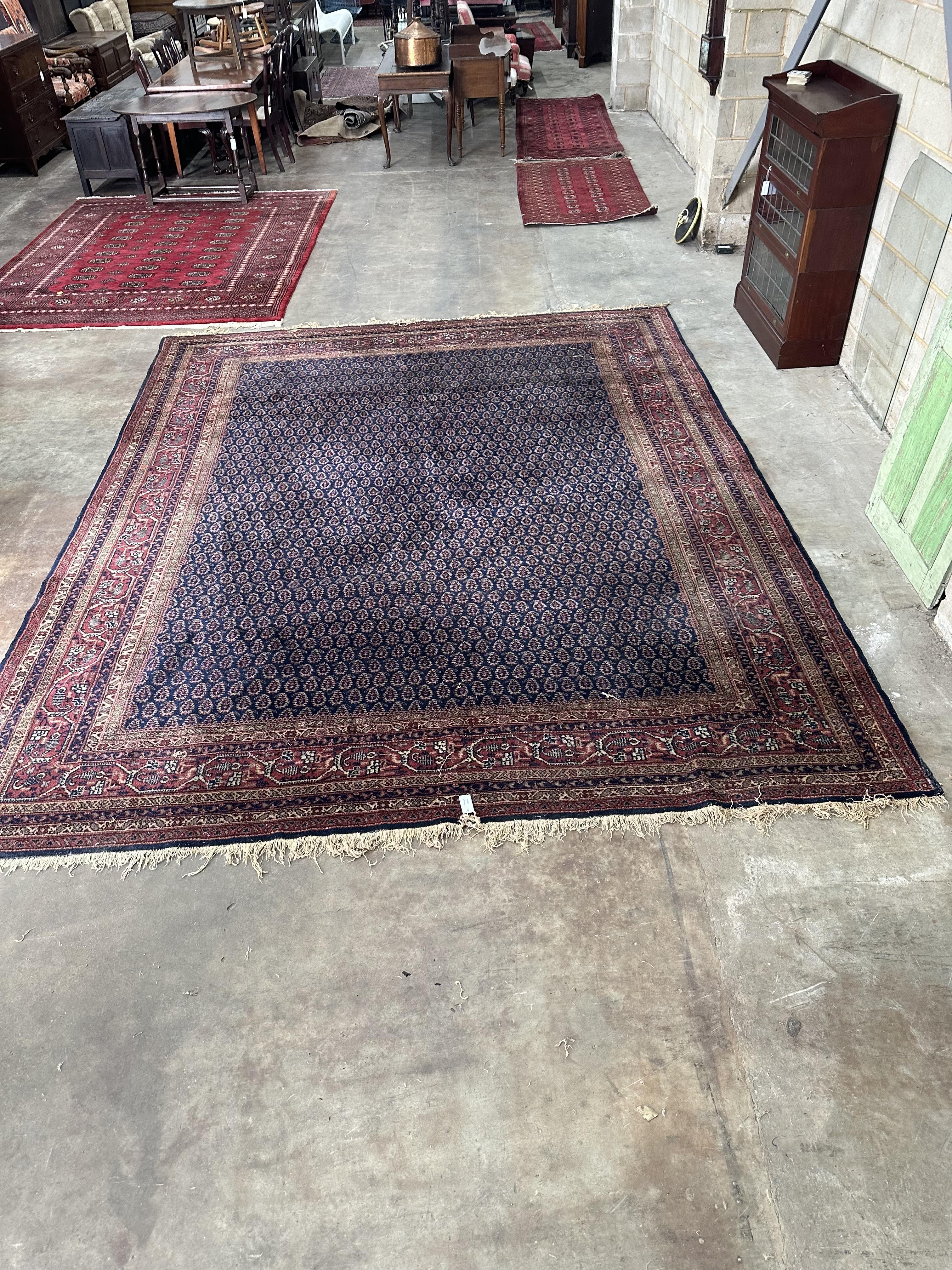 A North West Persian blue ground carpet, 390 x 318cm